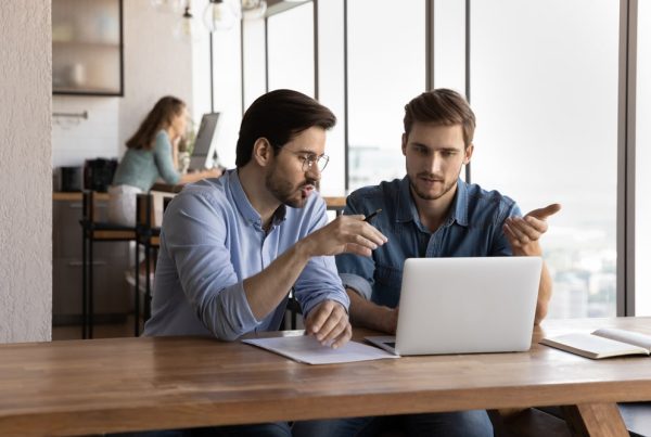 2 people talking on a computer