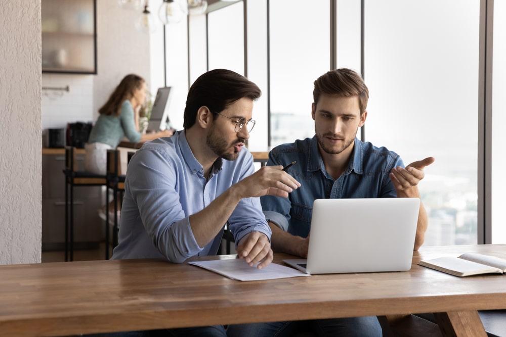 2 people talking on a computer