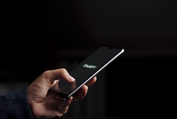 User with phone, searching the internet using ChatGPT