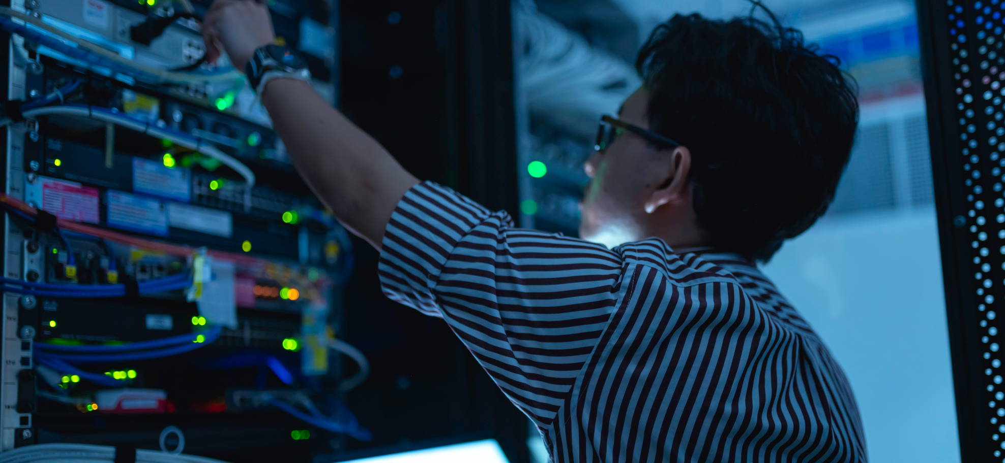 man reaching to server